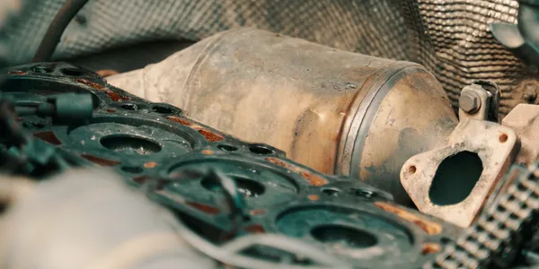 Close-up of a diesel particulate filter and exhaust components during assessment